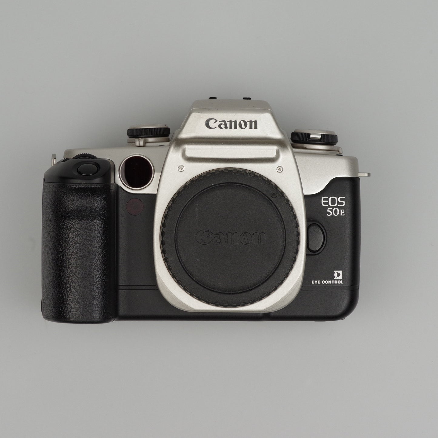 Canon EOS 50E camera on a gray background