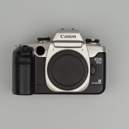 Canon EOS 50E camera on a gray background