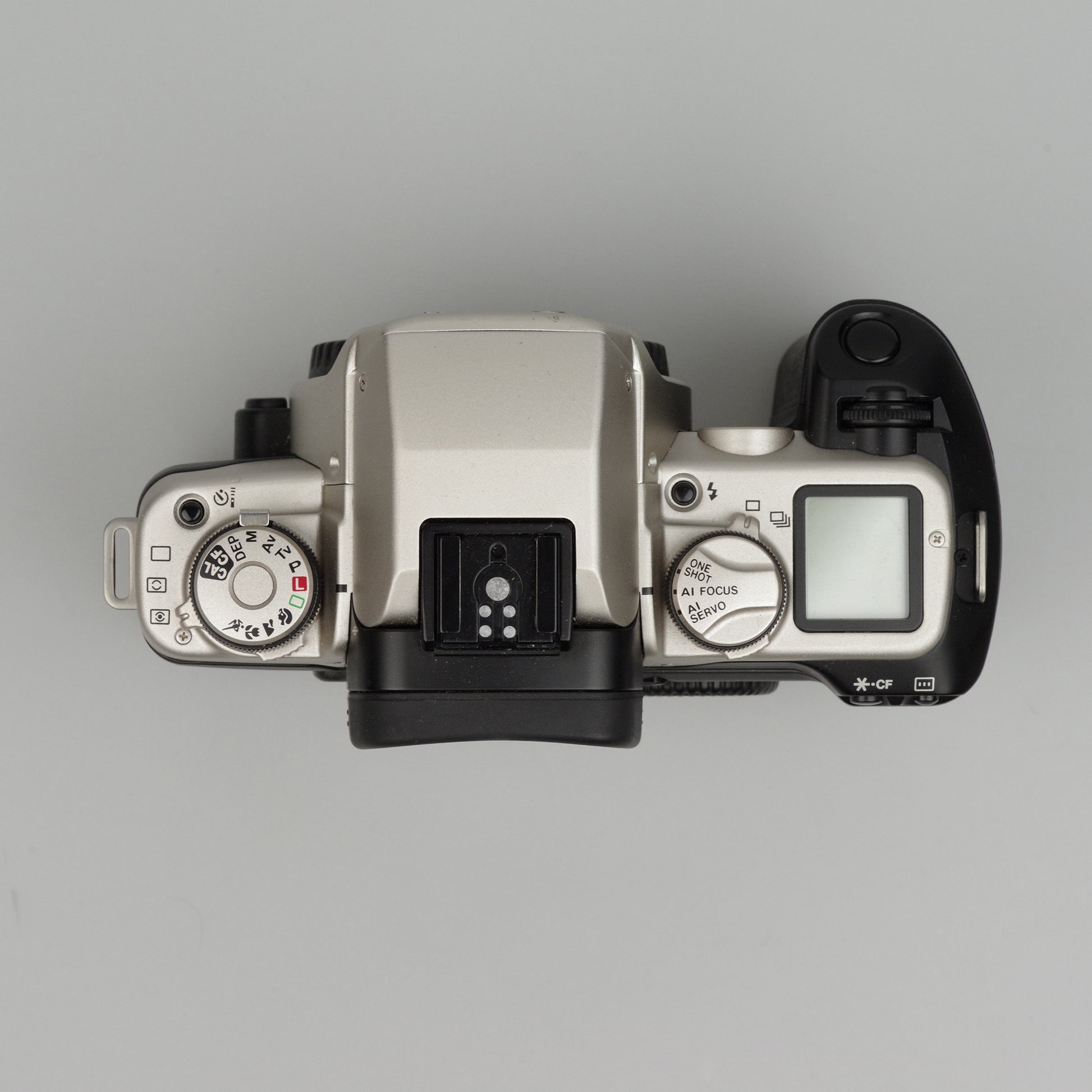 Top view of a camera body on a gray background