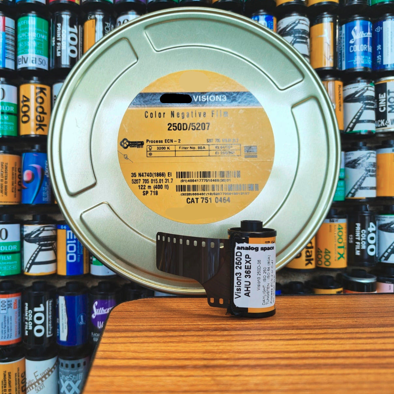 Roll of Vision3 35mm film with a 122m reel can of said film
