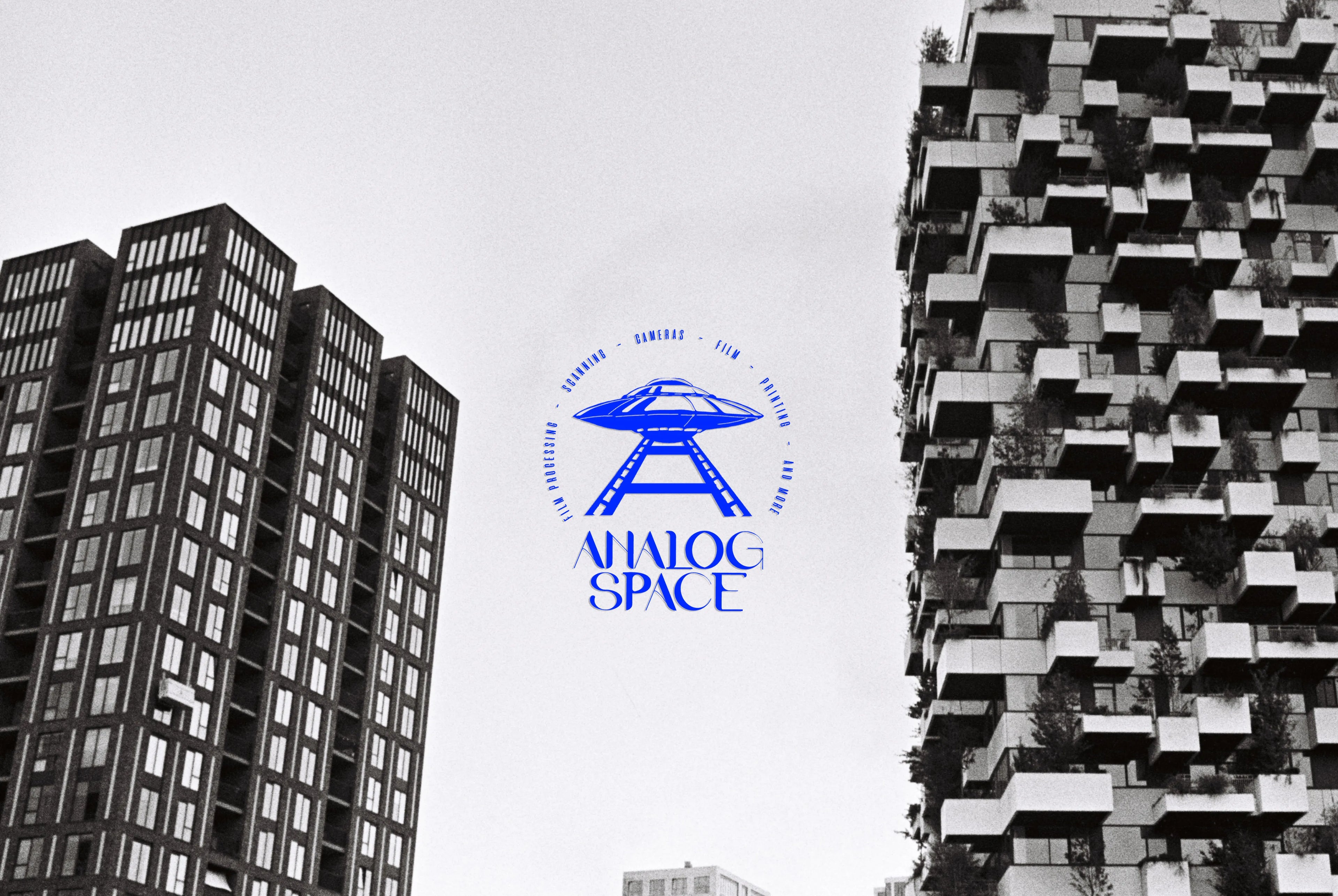 Modern buildings with 'Analog Space' logo in the center